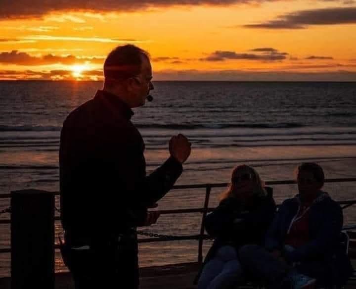 Mark community talk at sunset